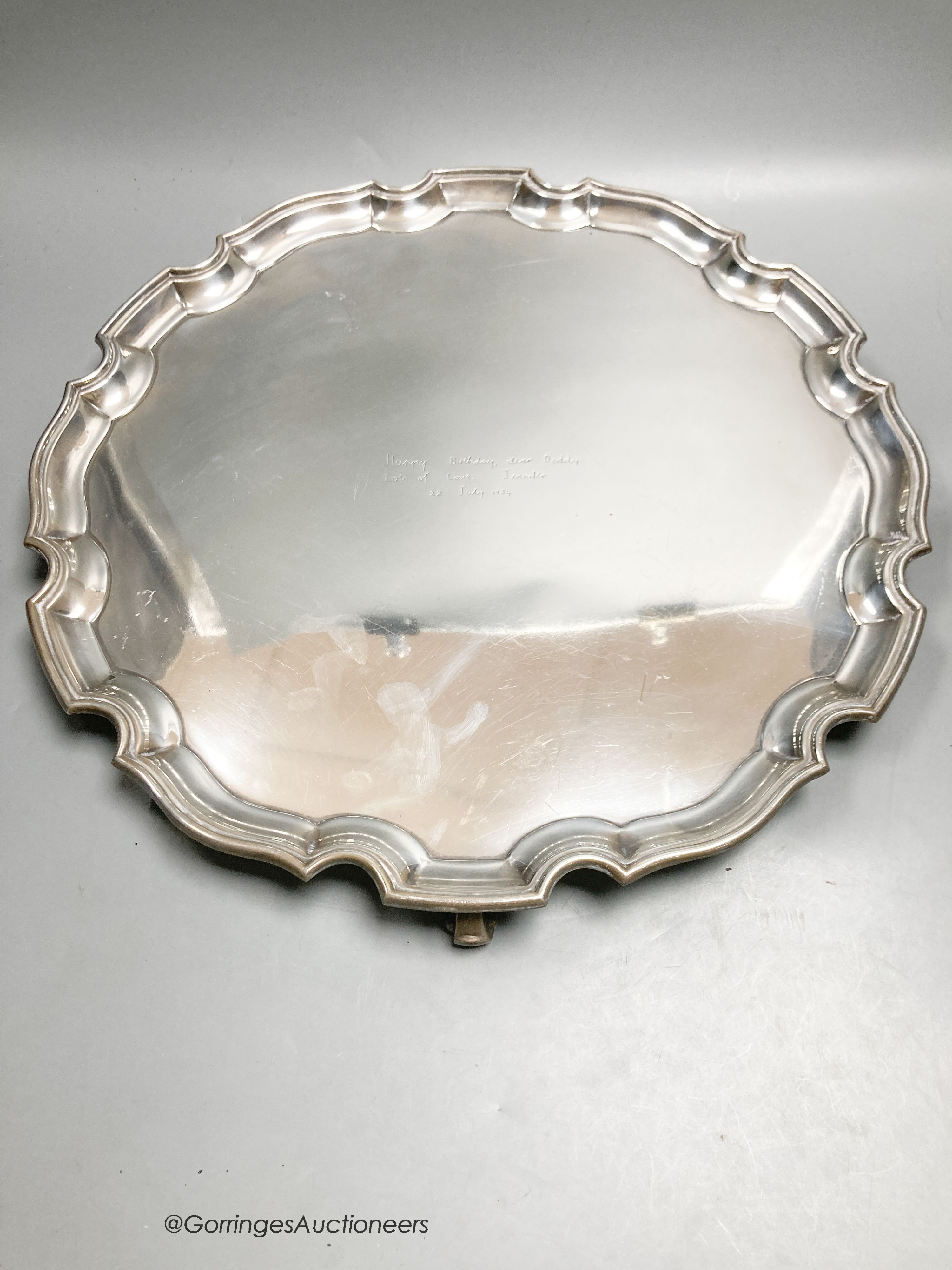 A circular silver salver with Chippendale border, diameter 41cm, Birmingham 1950, 63.5oz.
